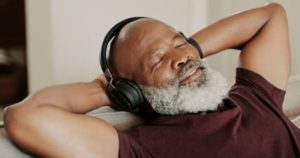 man enjoying music with headphones