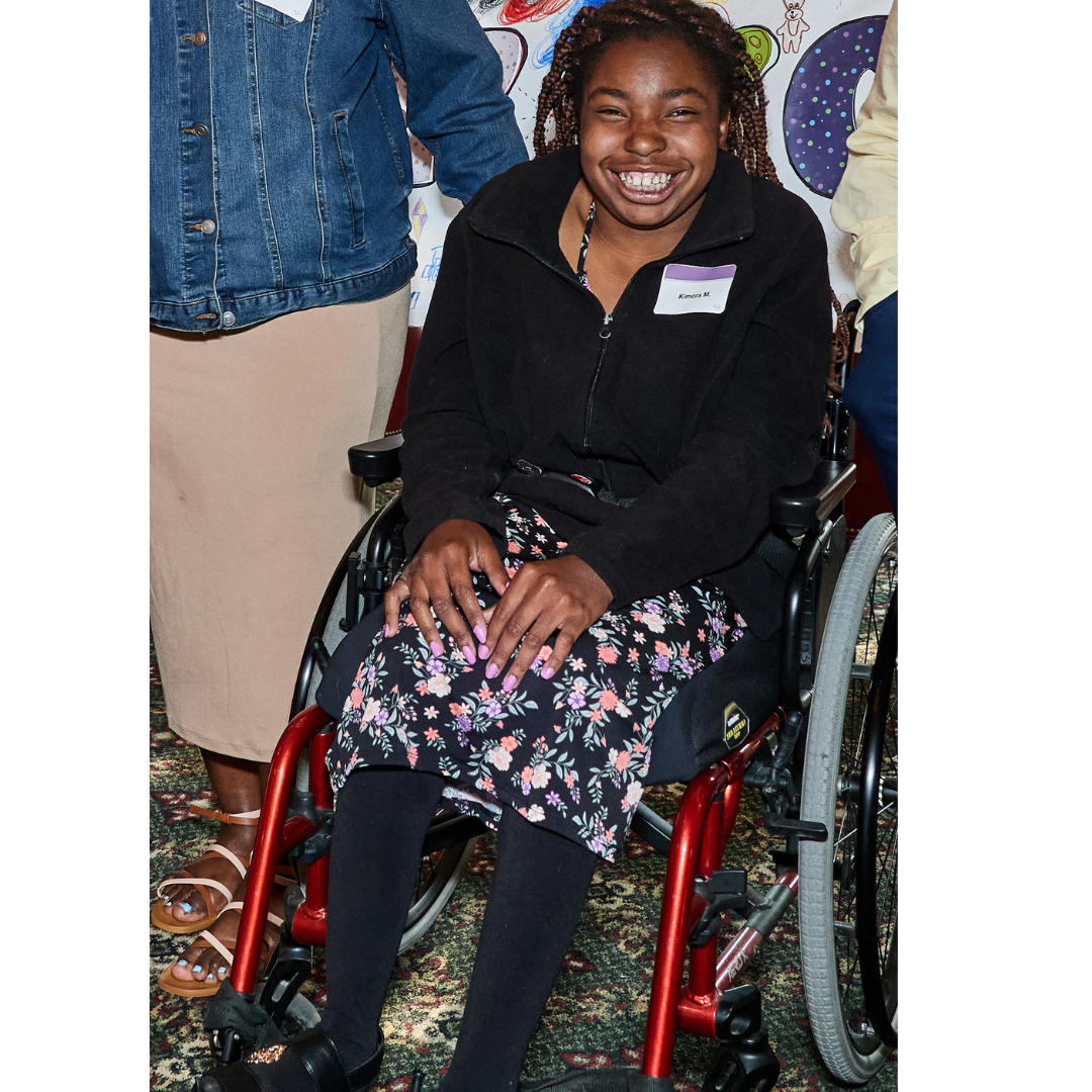 Image of a female using a wheelchair