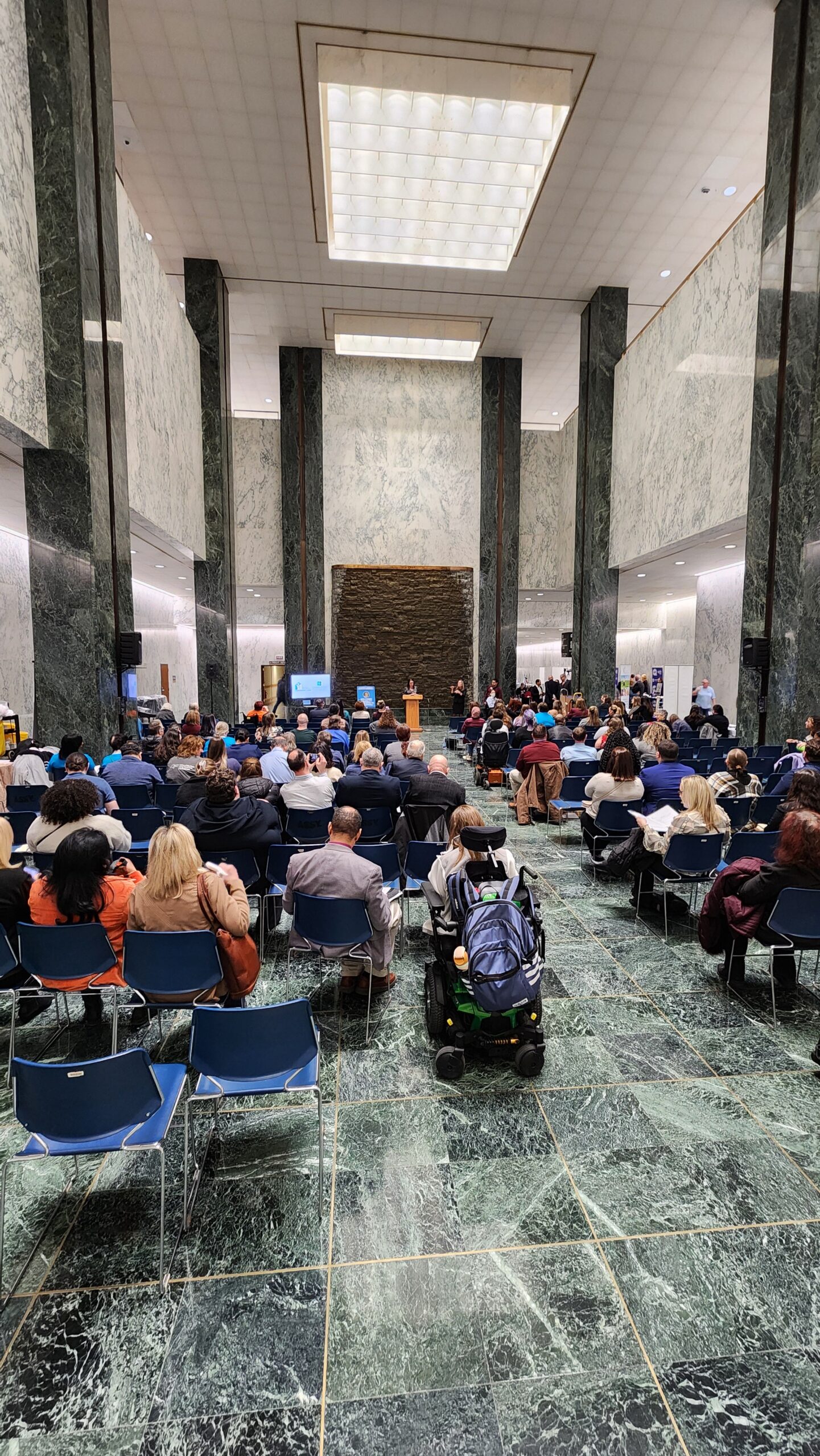 Advocacy Day - group meeting taking place in a building lobby